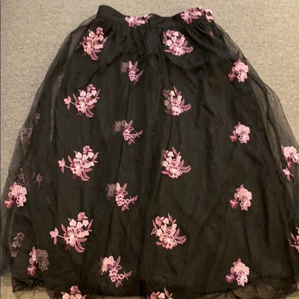 Black skirt with floral embroidery throughout